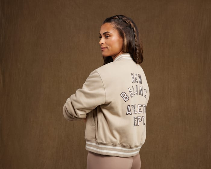 Sydney McLaughlin-Levrone models a New Balance jacket.